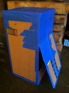 DIY Cardboard Mailbox Play: A flap on the back allows retrieval of "mail"