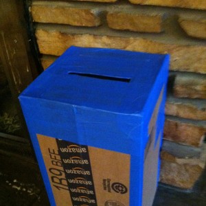 DIY Cardbord Mailbox: Reinforce the slot with tape.