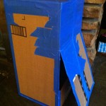 DIY Cardboard Mailbox Play: A flap on the back allows retrieval of "mail"